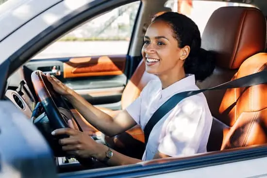 Smiling woman driving — Florida auto insurance made simple Smiling woman driving — Florida auto insurance made simple